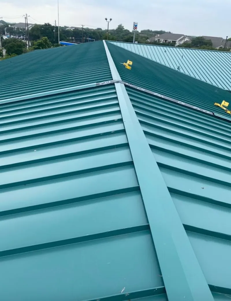 Green commercial metal roof ridge and valley for Metal Roof Repair in St. Albans