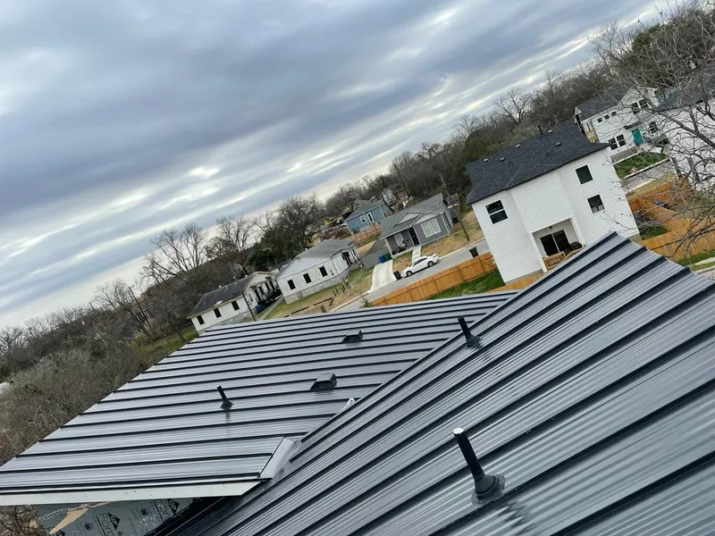 Standing seam metal roof panels with vents for Skylight Repair in St. Albans